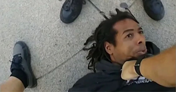 Homeless Black man being stomped by police