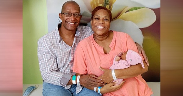 Susie Troxler with husband and newborn baby